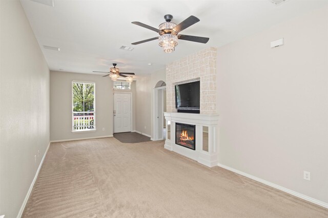 unfurnished living room featuring visible vents, carpet flooring, baseboards, and ceiling fan