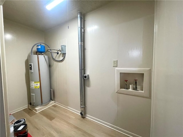 utility room featuring water heater