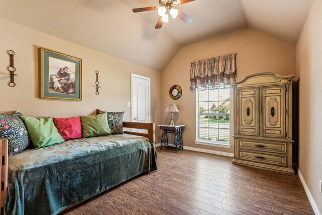 bedroom with lofted ceiling, a ceiling fan, wood finished floors, and baseboards