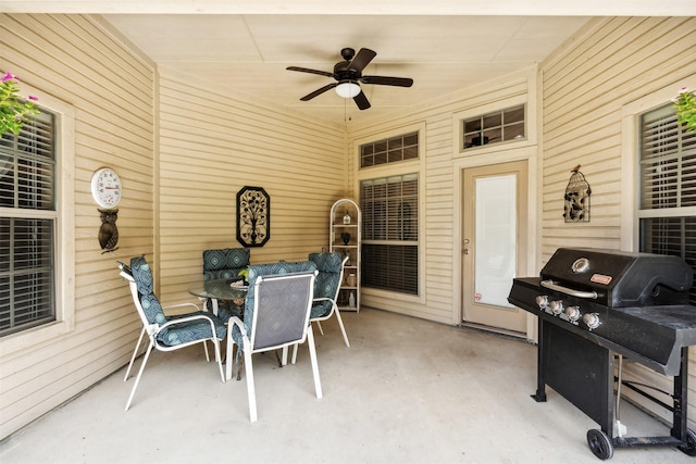 view of patio / terrace featuring a ceiling fan, outdoor dining area, and area for grilling