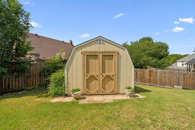 view of shed featuring a fenced backyard