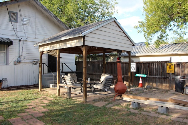 view of yard featuring a fenced backyard and a gazebo