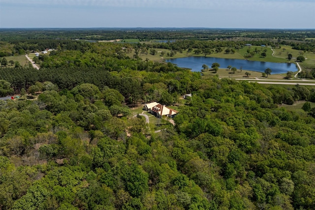 aerial view with a wooded view and a water view