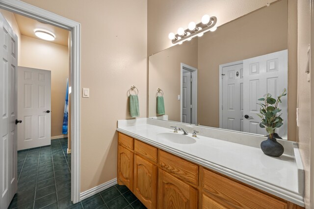 560 Glenn Ln, Red Oak, TX 75154 - bathroom with baseboards, tile patterned floors, and vanity