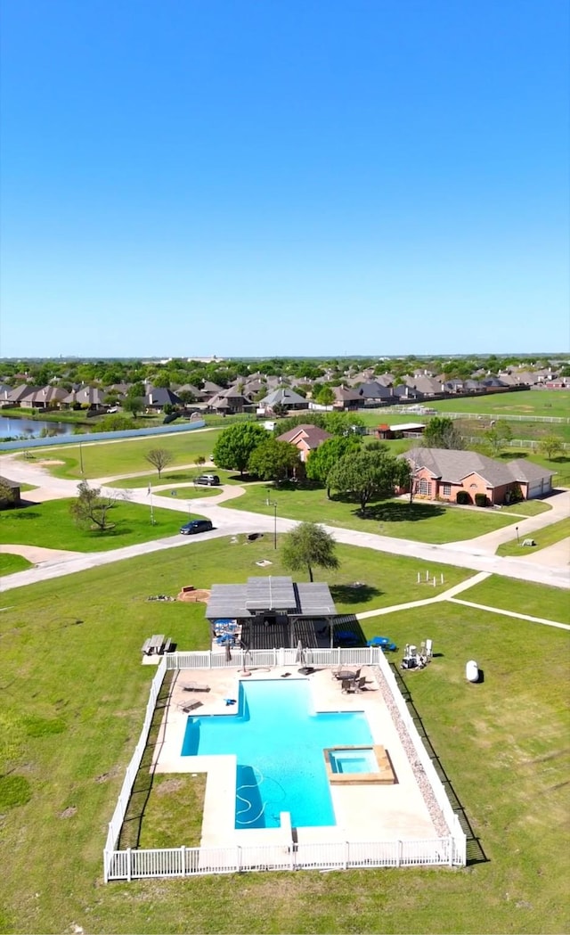 560 Glenn Ln, Red Oak, TX 75154 - view of pool featuring a lawn, a pool with connected hot tub, a residential view, and a water view