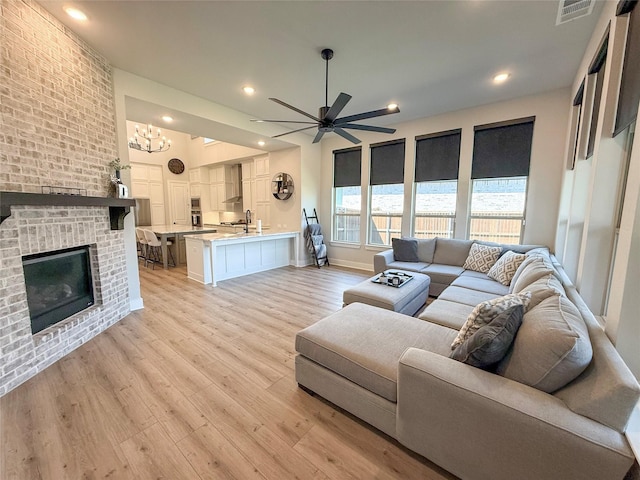 3810 Braxton Dr, Melissa, TX 75454 - living room with a ceiling fan, light wood-style floors, a chandelier, recessed lighting, and baseboards