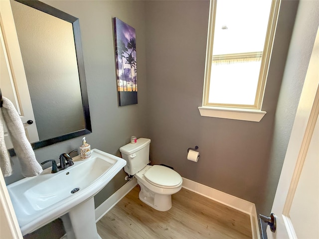 3810 Braxton Dr, Melissa, TX 75454 - bathroom with wood finished floors, toilet, baseboards, and a sink