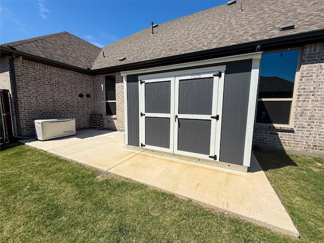 3810 Braxton Dr, Melissa, TX 75454 - back of house featuring brick siding, a patio area, a shingled roof, and a yard