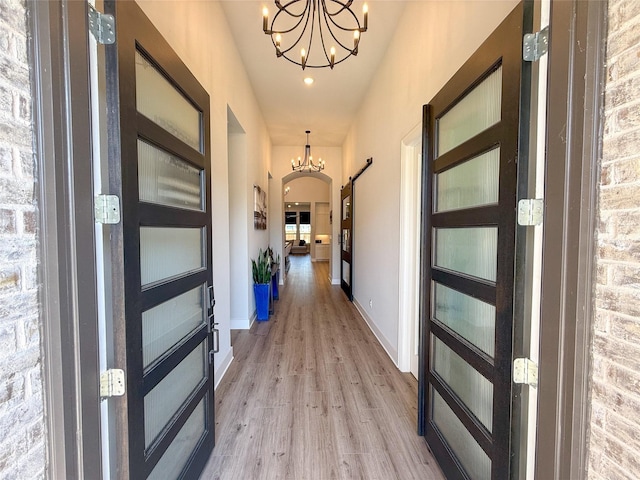 3810 Braxton Dr, Melissa, TX 75454 - hall featuring a chandelier, light wood-style floors, a barn door, recessed lighting, and baseboards