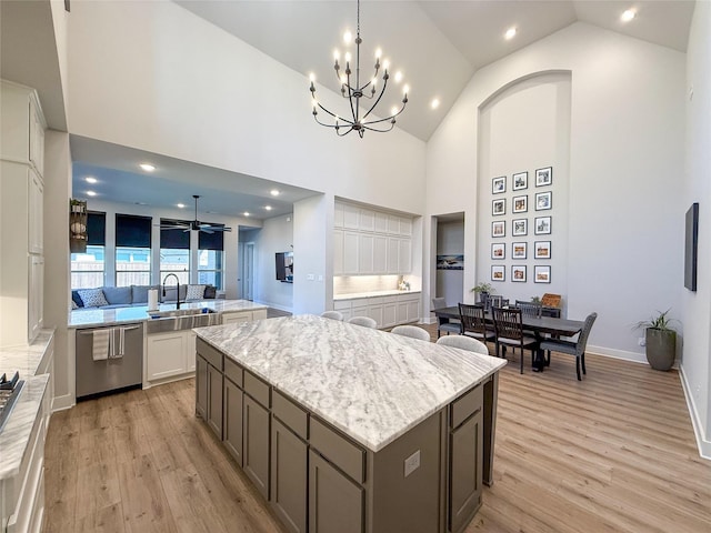 3810 Braxton Dr, Melissa, TX 75454 - kitchen featuring dishwasher, a kitchen island, a sink, light wood-style flooring, and a chandelier