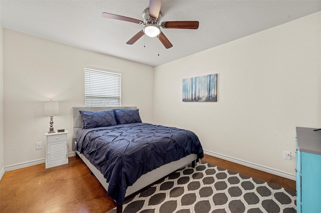 bedroom with baseboards and ceiling fan