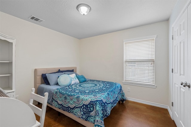 bedroom with a textured ceiling, baseboards, visible vents, a closet, and carpet floors