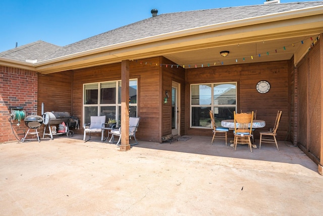 249 Winchester St, Tuscola, TX 79562 - back of property with a patio area and a shingled roof