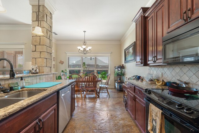 249 Winchester St, Tuscola, TX 79562 - kitchen featuring backsplash, a sink, black appliances, a chandelier, and hanging light fixtures