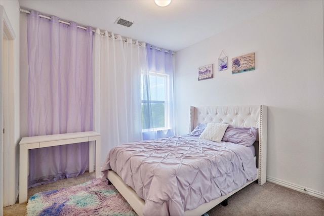 bedroom featuring visible vents and carpet flooring