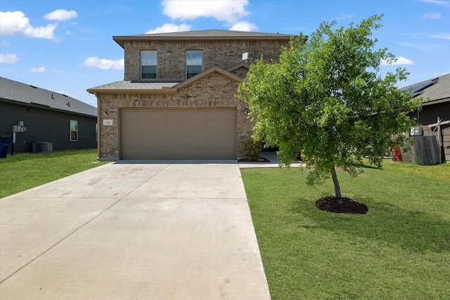 traditional home featuring concrete driveway, central AC unit, brick siding, and a front lawn