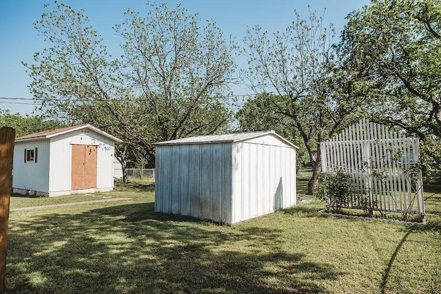 view of shed with fence