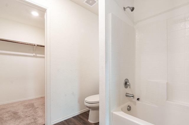 413 Everglades St, Princeton, TX 75407 - bathroom featuring wood finished floors, toilet,  shower combination, and visible vents
