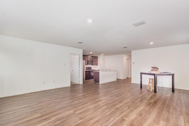 413 Everglades St, Princeton, TX 75407 - unfurnished living room featuring recessed lighting and light wood-style flooring