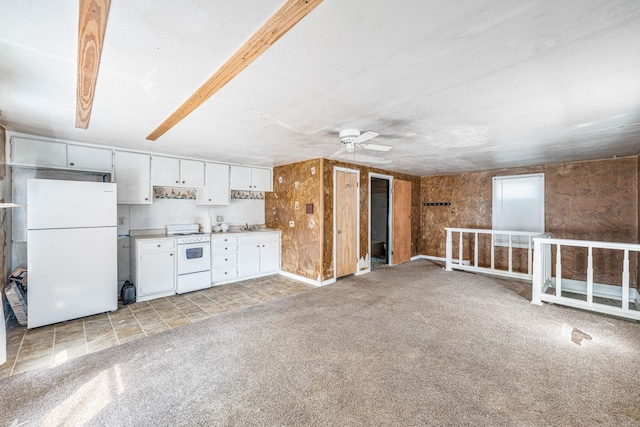 kitchen with white cabinets, a sink, light colored carpet, a ceiling fan, and white appliances