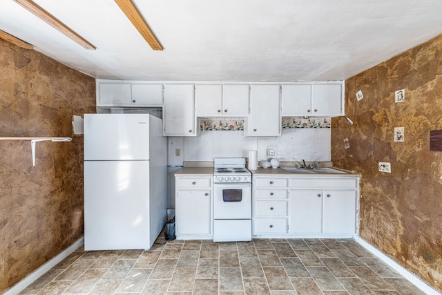 kitchen with light countertops, a sink, white appliances, baseboards, and white cabinetry
