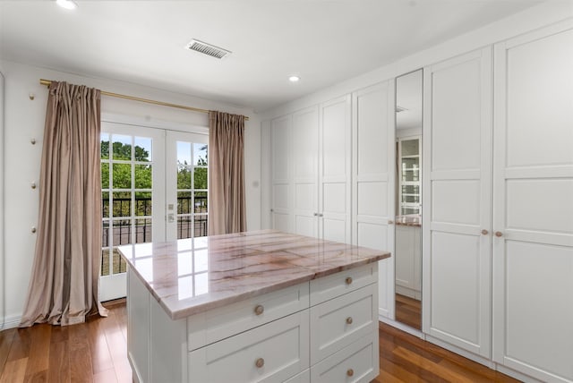 spacious closet with wood finished floors and visible vents