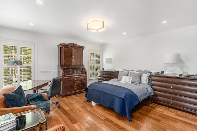 bedroom featuring light wood finished floors and recessed lighting