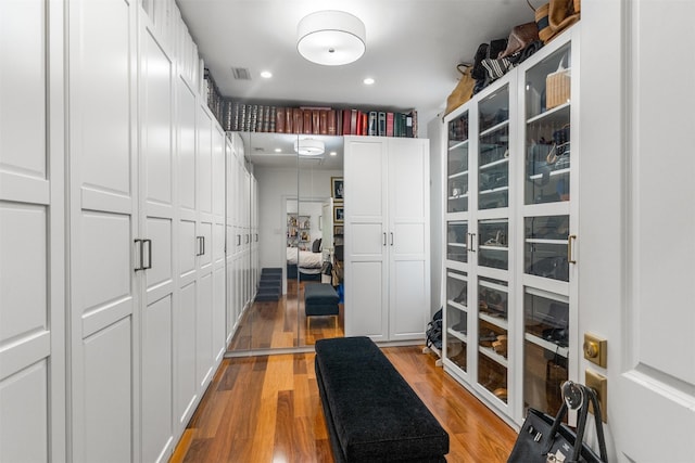 spacious closet with light wood-type flooring and visible vents