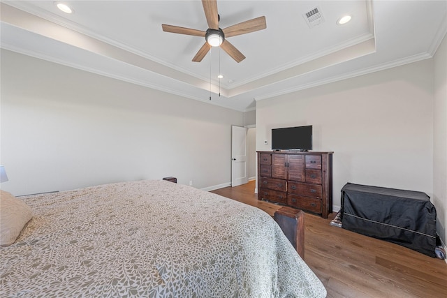 301 Wycliff Dr, Waco, TX 76633 - bedroom featuring crown molding, wood finished floors, visible vents, and a raised ceiling