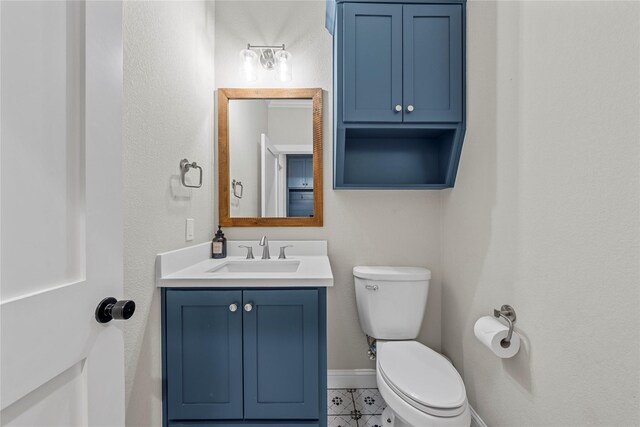 301 Wycliff Dr, Waco, TX 76633 - bathroom with toilet, vanity, and baseboards
