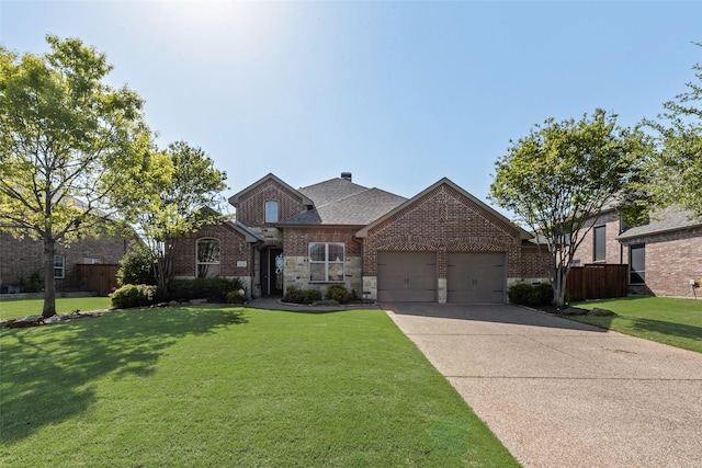 1121 Kirkwood Ln, Prosper, TX 75078 - view of front of home with a front lawn, driveway, fence, brick siding, and a garage