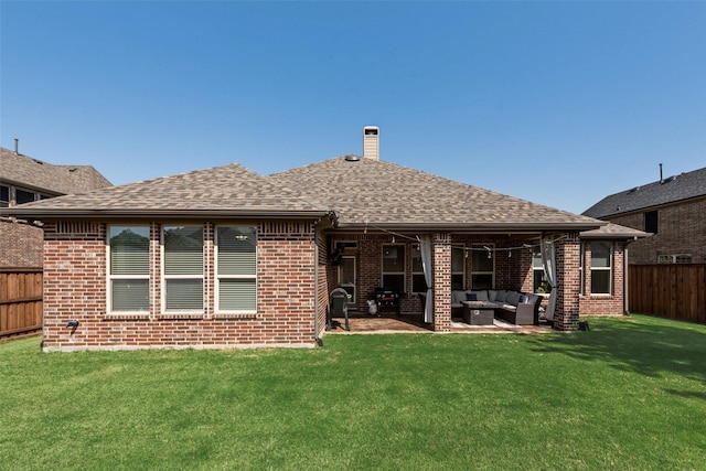 1121 Kirkwood Ln, Prosper, TX 75078 - rear view of house featuring a fenced backyard, brick siding, an outdoor living space, and a yard