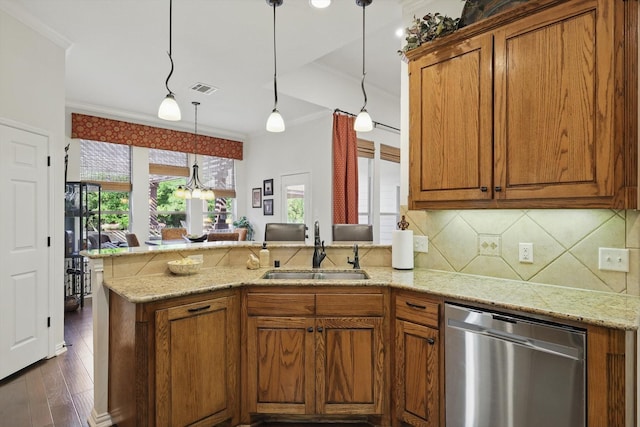 114 Deer Crossing Way, Azle, TX 76020 - kitchen with stainless steel dishwasher, a sink, a peninsula, brown cabinetry, and decorative backsplash