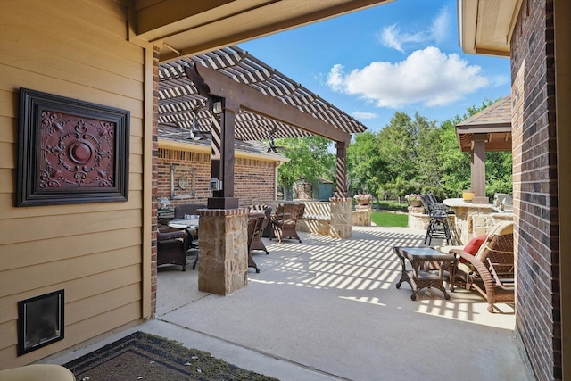 view of patio / terrace with a pergola and outdoor dining area