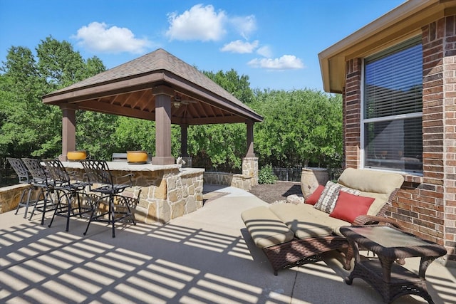 view of patio / terrace with a gazebo and outdoor dry bar