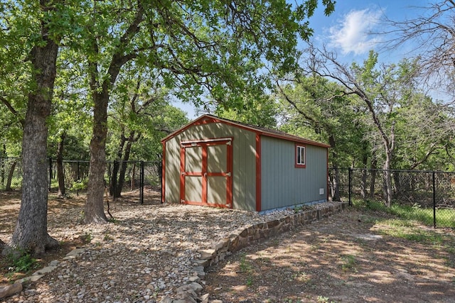view of shed featuring a fenced backyard
