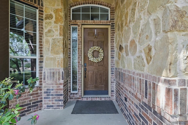 114 Deer Crossing Way, Azle, TX 76020 - doorway to property featuring stone siding and a porch