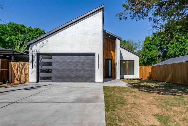 2229 Varsity Dr, Grand Prairie, TX 75051 - view of front facade featuring brick siding, a front yard, concrete driveway, and fence