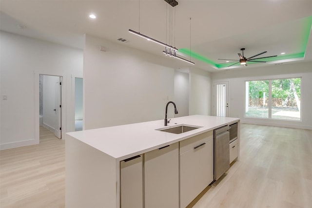 2229 Varsity Dr, Grand Prairie, TX 75051 - kitchen with a sink, a center island with sink, open floor plan, light wood-style floors, and dishwasher