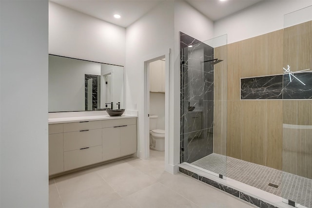 2229 Varsity Dr, Grand Prairie, TX 75051 - bathroom with tile patterned flooring, toilet, vanity, and a walk in shower
