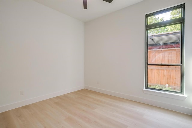 2229 Varsity Dr, Grand Prairie, TX 75051 - unfurnished room with ceiling fan, baseboards, and light wood finished floors