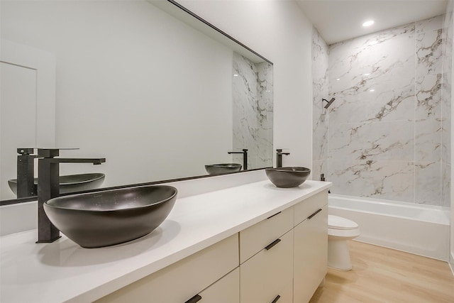 2229 Varsity Dr, Grand Prairie, TX 75051 - full bath with toilet, wood finished floors, a sink, and double vanity