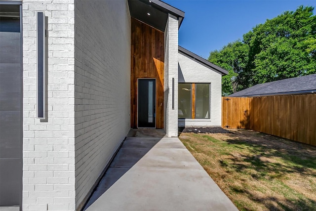 2229 Varsity Dr, Grand Prairie, TX 75051 - view of exterior entry with fence and a patio area