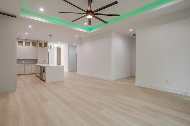 2229 Varsity Dr, Grand Prairie, TX 75051 - unfurnished living room featuring a sink, light wood-type flooring, baseboards, recessed lighting, and ceiling fan