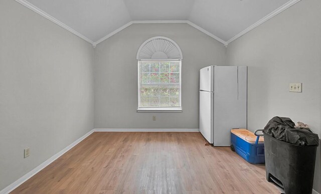 2618 S 2nd St, Waco, TX 76706 - interior space featuring lofted ceiling, ornamental molding, light wood-style floors, and baseboards
