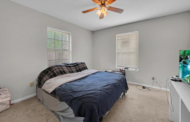 2618 S 2nd St, Waco, TX 76706 - bedroom with ceiling fan, baseboards, and light colored carpet