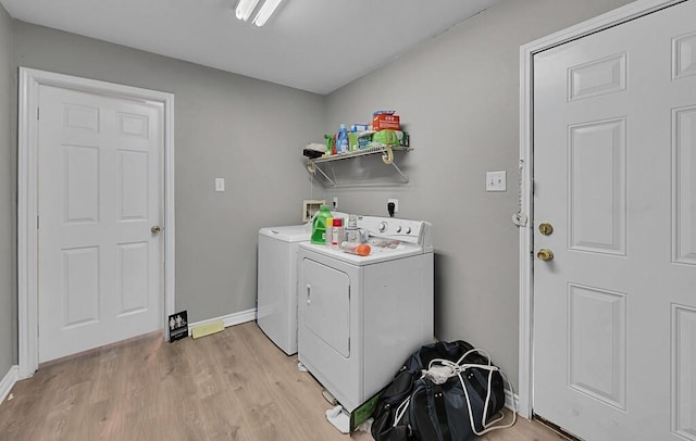 2618 S 2nd St, Waco, TX 76706 - washroom with baseboards, light wood-type flooring, laundry area, and independent washer and dryer