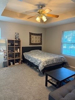2618 S 2nd St, Waco, TX 76706 - bedroom with a raised ceiling, carpet, and ceiling fan