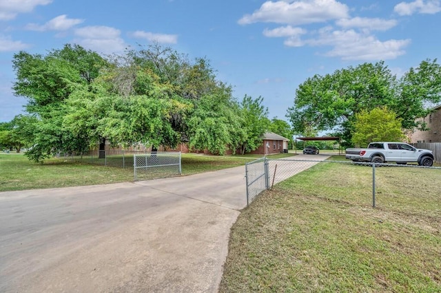 2618 S 2nd St, Waco, TX 76706 - view of road with a gated entry and concrete driveway