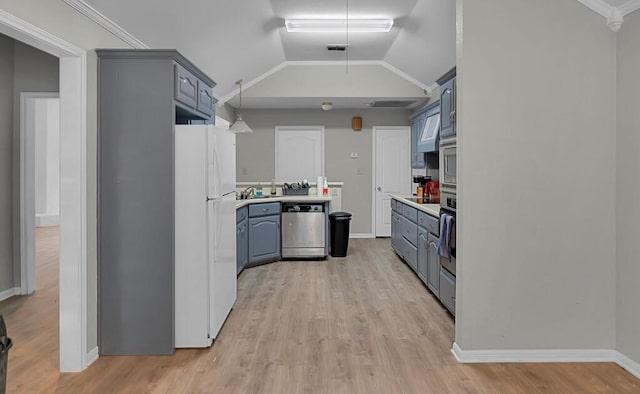 2618 S 2nd St, Waco, TX 76706 - kitchen featuring light countertops, light wood-type flooring, appliances with stainless steel finishes, and blue cabinetry